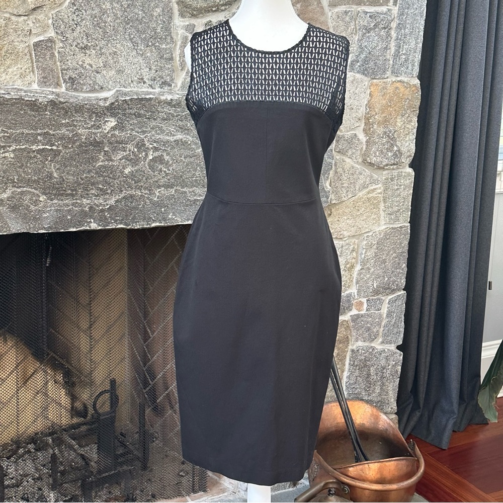 Banana Republic little black dress with mesh detail at top and back slit.